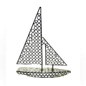 Silver tone metal sailboat art piece or earring holder?